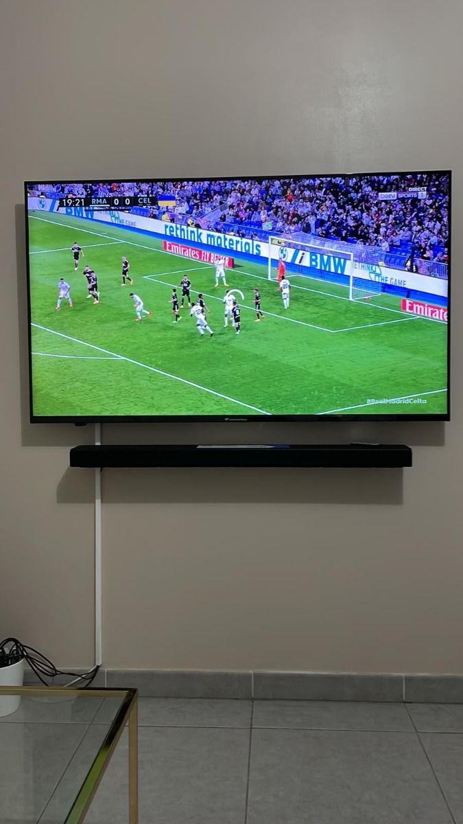 Wide flat screen television showing Garox TV entertainment home menu